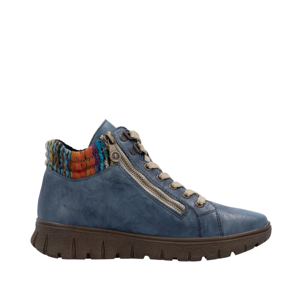 Rieker N1305-14 women's blue leather ankle boots with lace-up and side zipper, colorful woven trim, and rugged sole.