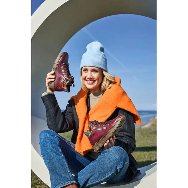 Rieker N1305-35 women's red leather ankle boots with zip and lace-up design, trendy outdoor footwear.