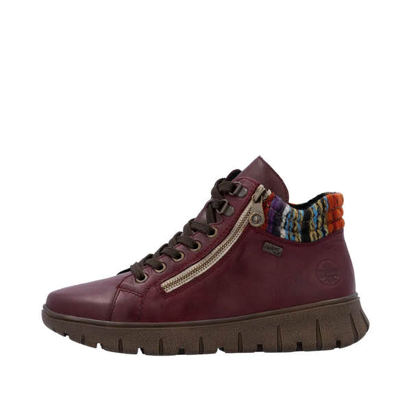 Rieker N1305-35 women's red leather ankle boots with zip and lace-up closure, featuring colorful patterned collar and chunky sole.