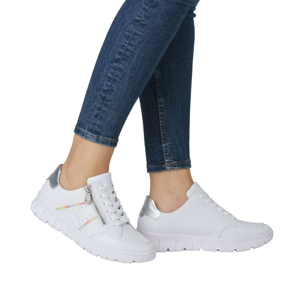 Rieker N1313-80 ladies white leather trainers with zip and lace, wide fit, silver accents, casual style.