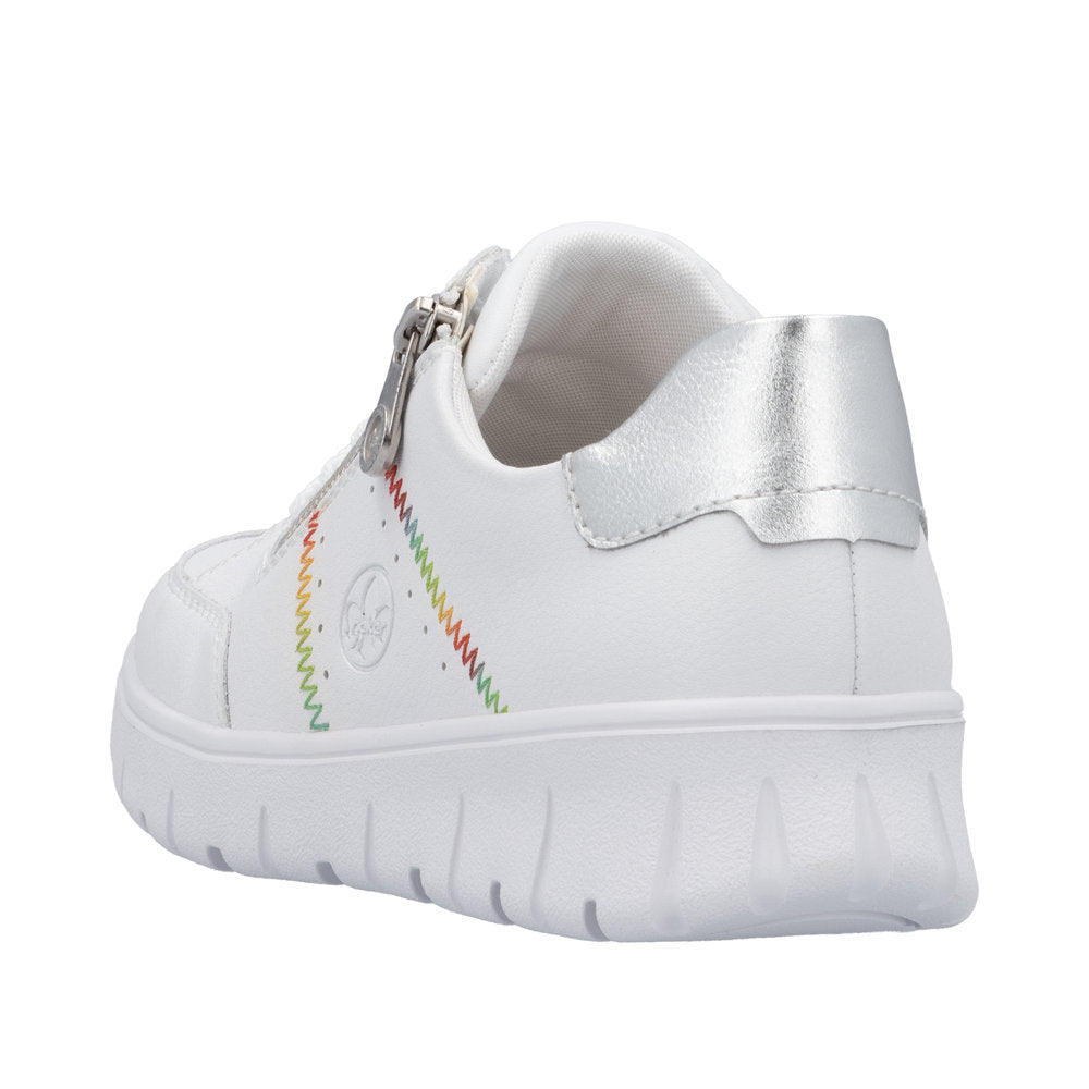 Rieker N1313-80 women's wide white leather trainers with zip and lace, featuring colorful stitched designs and silver heel detail.