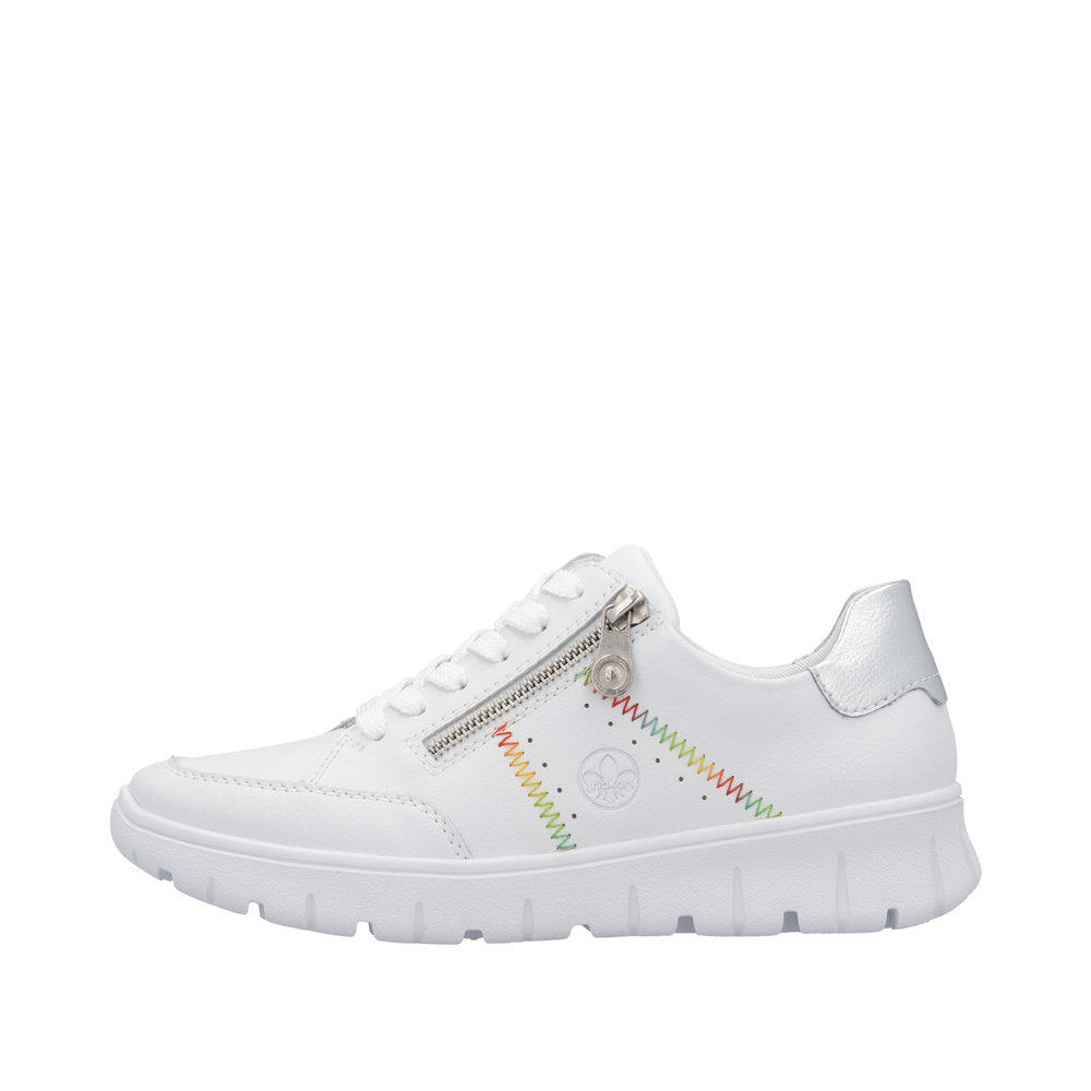 Rieker N1313-80 women's wide-fit white leather trainers with zip and lace, trendy zigzag rainbow stitching, and chunky sole.