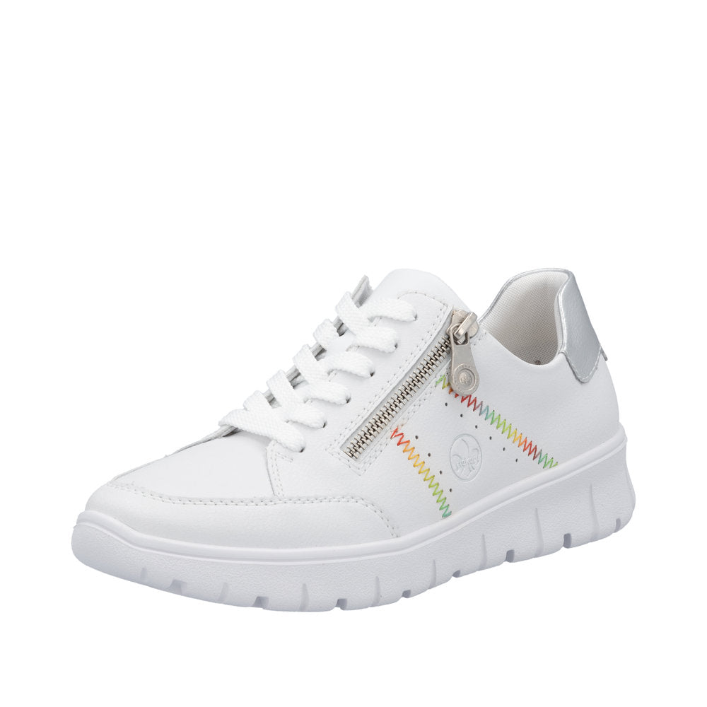 Rieker N1313-80 ladies' wide-fit white leather trainers with zip and lace-up closure, colorful stitch detail, and silver accents.