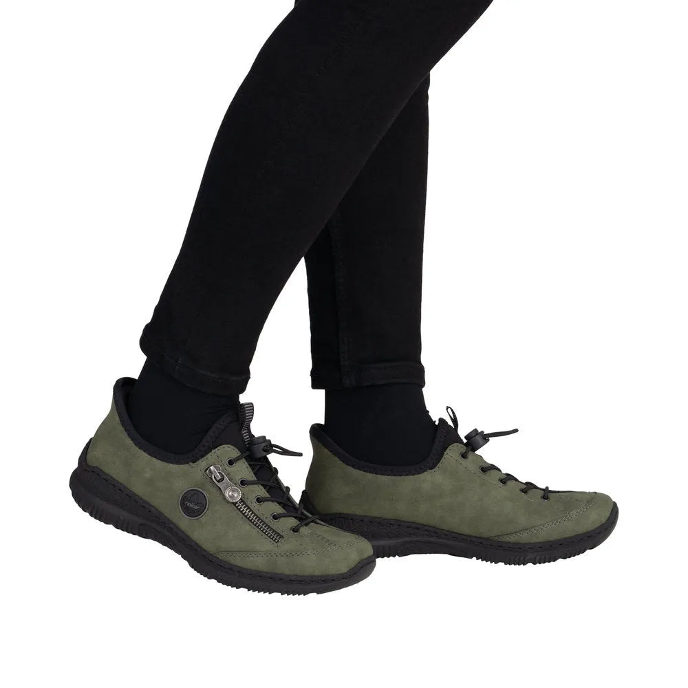 Rieker N3267-54 women's green slip-on shoes with black sole and zipper detail, casual ready2go flat footwear.