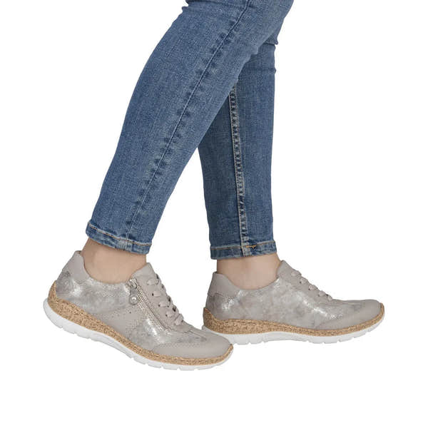 Women's metallic grey sneakers with lace and zip details, cork-like midsole, and white rubber outsoles.