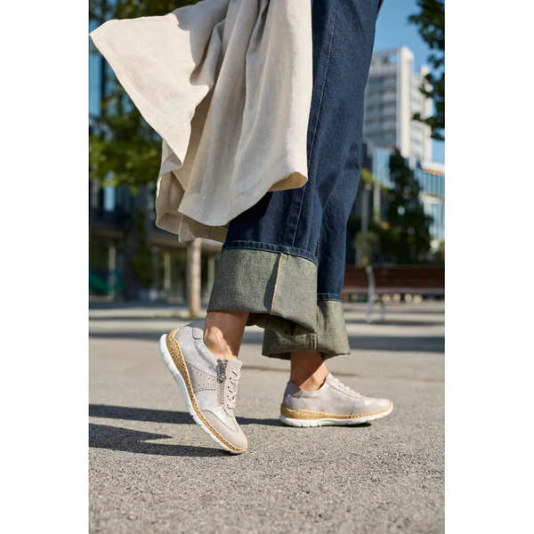 Rieker N4221-90 ladies rose-metallic zip and lace shoes, casual style with metallic finish, worn with denim rolled-up cuffs.