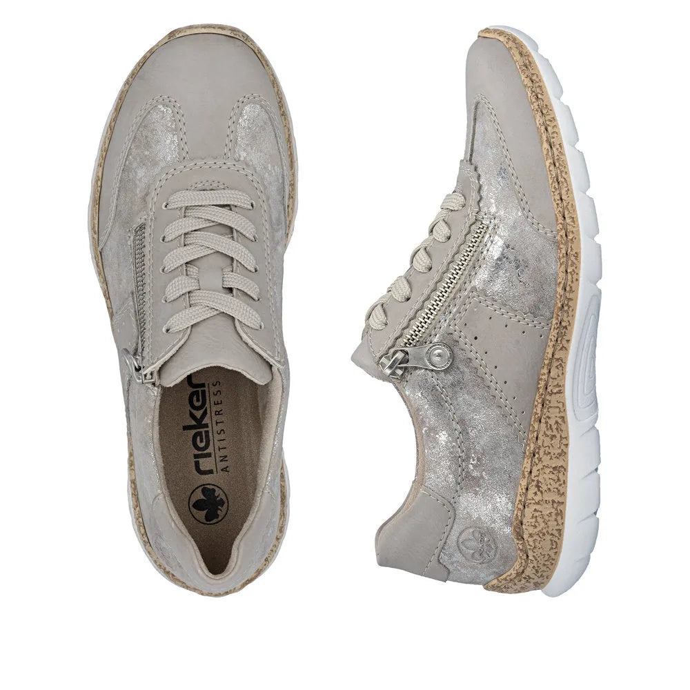Light gray metallic lace-up shoes with zippers, chunky beige soles, and distressed details for women.
