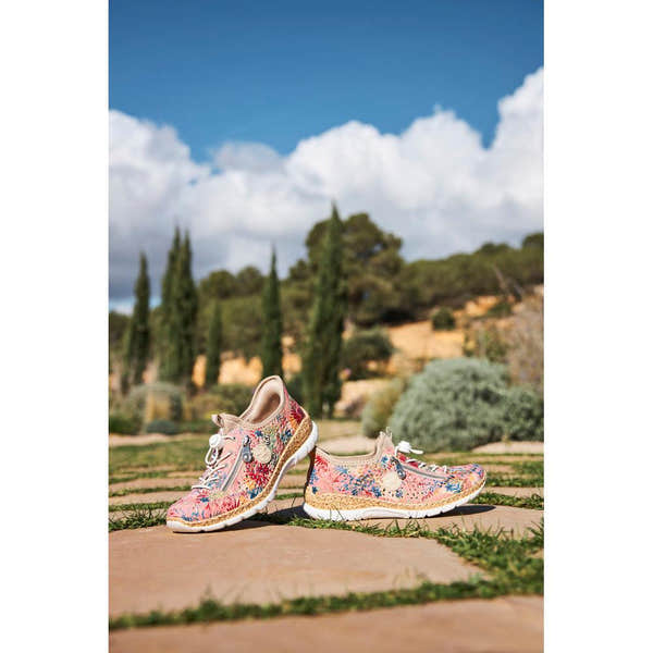 Rieker N42V3-90 women's multi-colored elasticated casual shoes with floral pattern and cushioned sole, outdoor setting.