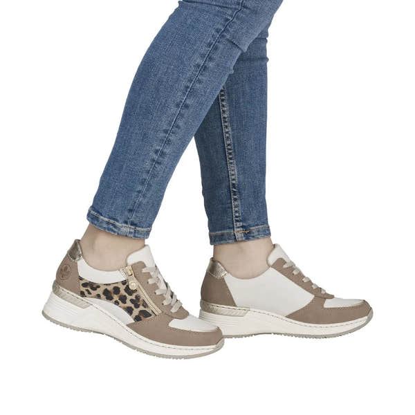 Rieker N4308-64 ladies wide taupe, white, leopard print zip & lace trainers, with mesh and synthetic materials, worn with jeans.