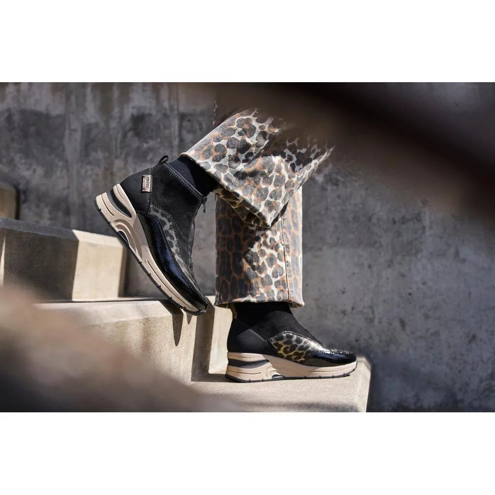 Rieker N9362-00 women's black textile and leopard print ankle boots with front zipper and chunky sole.