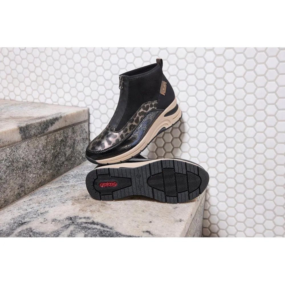 Rieker N9362-00 women's black textile ankle boots with front zip, leopard print accents, chunky sole, and slip-on style.