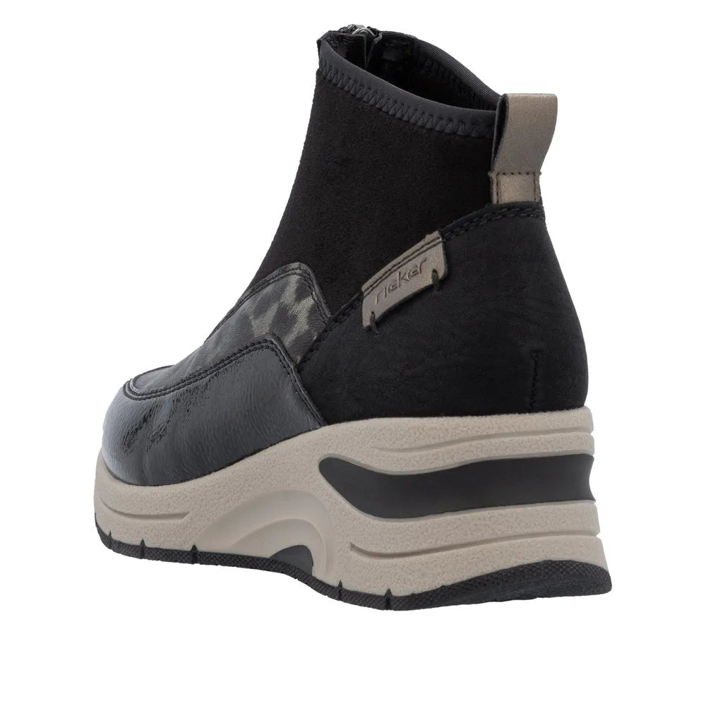 Rieker N9362-00 women's black ankle boots with textile front zip and chunky sole design.