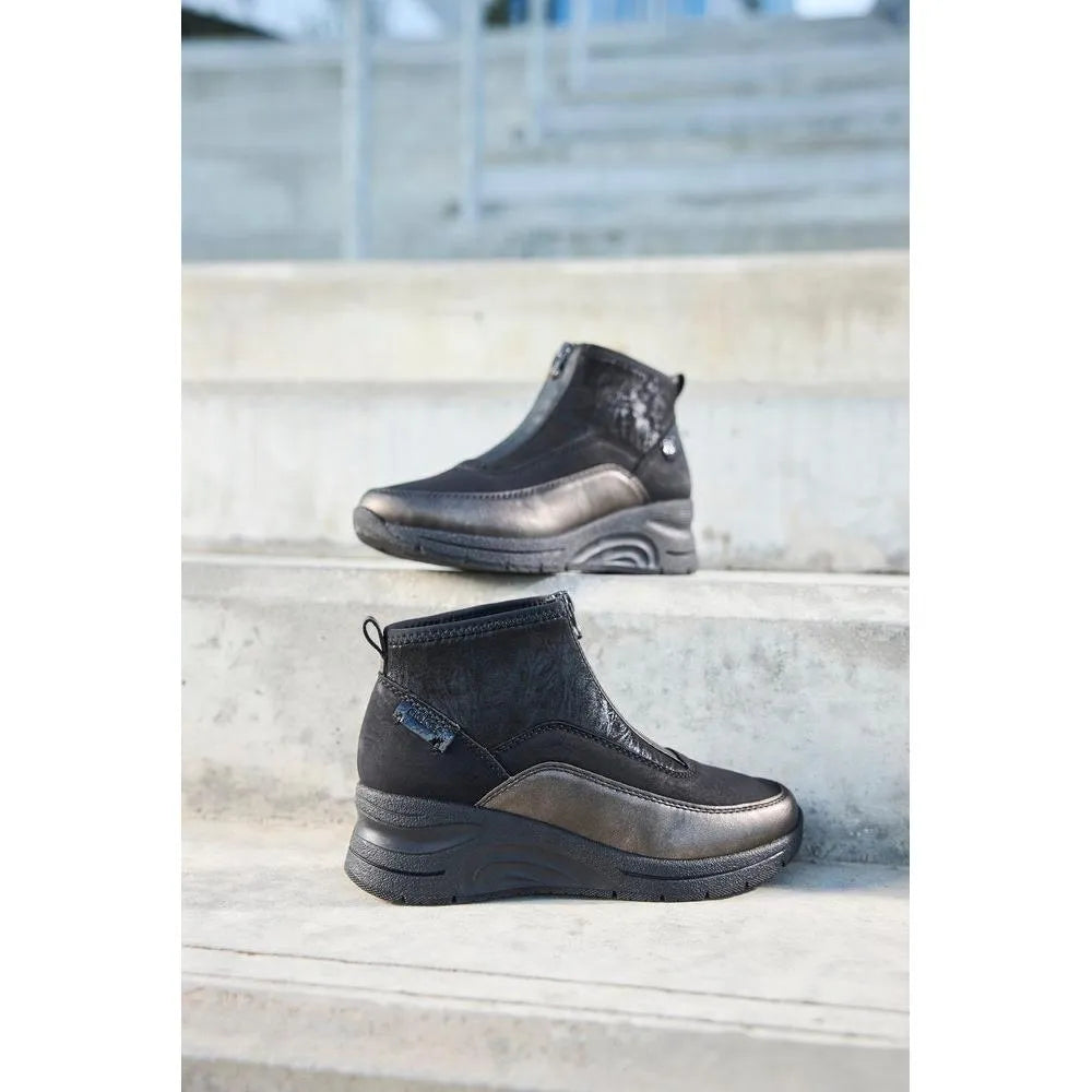 Rieker N9362-01 Ladies Black Combi Textile Front Zip Ankle Boots on outdoor stairs.