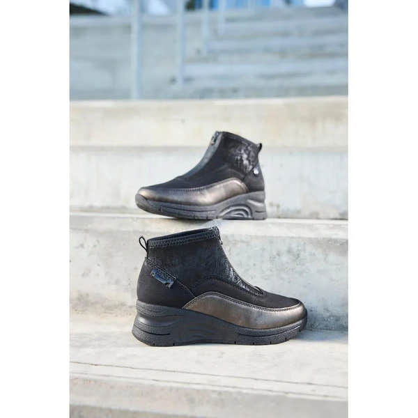 Rieker N9362-01 Ladies Black Combi Textile Front Zip Ankle Boots on outdoor stairs.