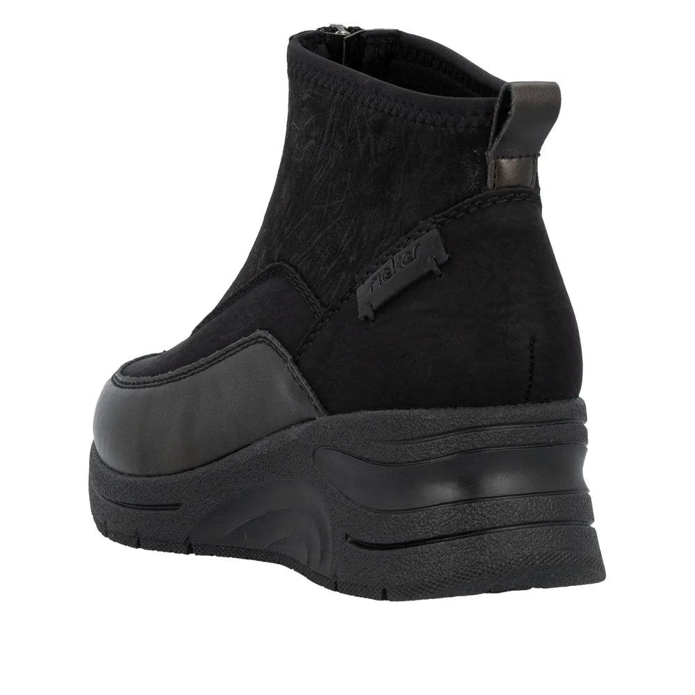 Rieker N9362-01 womens black ankle boots with textile front zip, chunky sole and combed design.