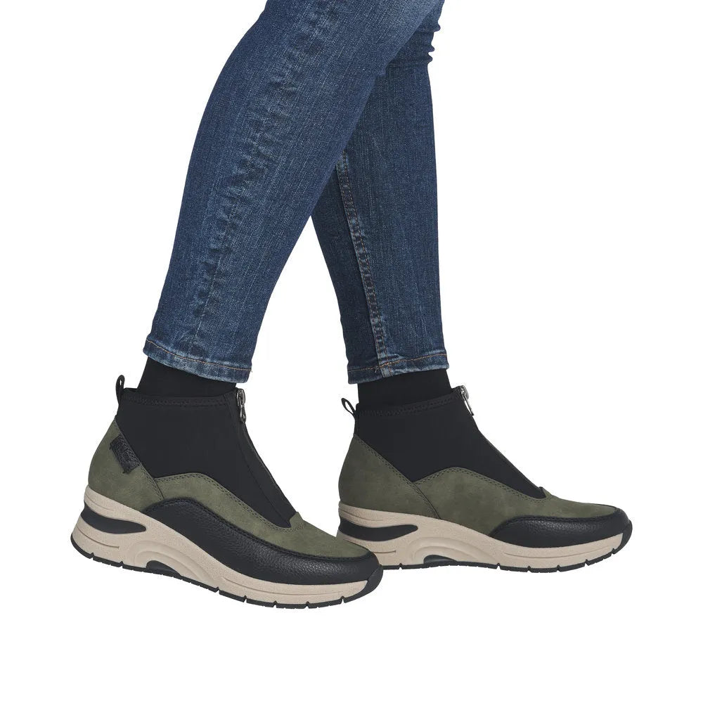 Rieker N9362-54 women's green front zip ankle boots with black accents and chunky beige rubber sole.