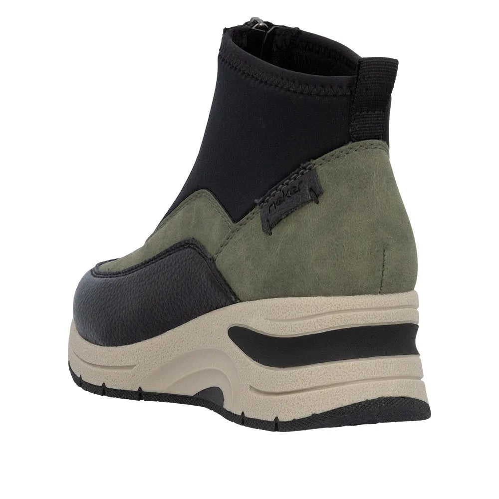 Rieker N9362-54 women's green ankle boots with front zip, black accents, and chunky beige and black sole.