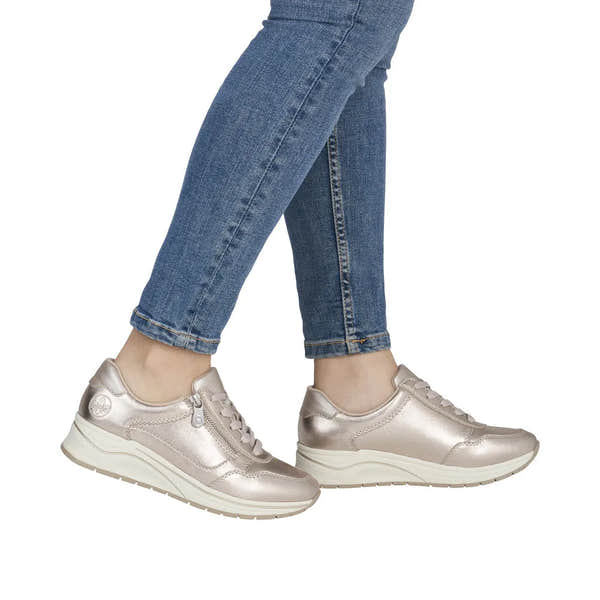 Rieker women's wide-fit champagne leather sneakers with zip and lace-up front, chunky white sole.