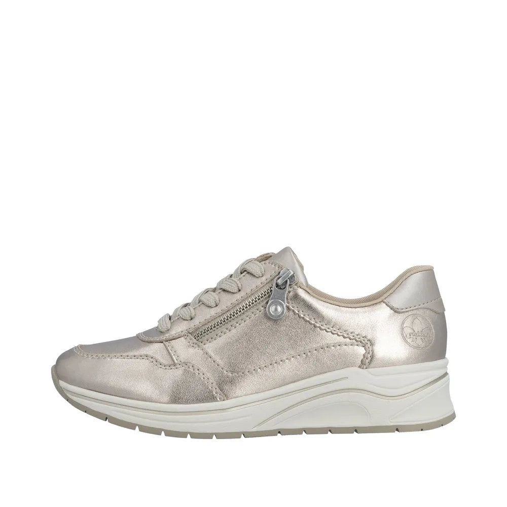 Rieker N9501-90 ladies wide champagne leather sneakers with zipper, lace-up detail, and chunky white sole.