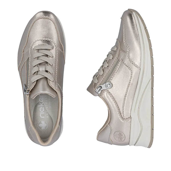 Women's champagne leather sneakers with zip and lace-up closure, cushioned sole, and side zipper detail.
