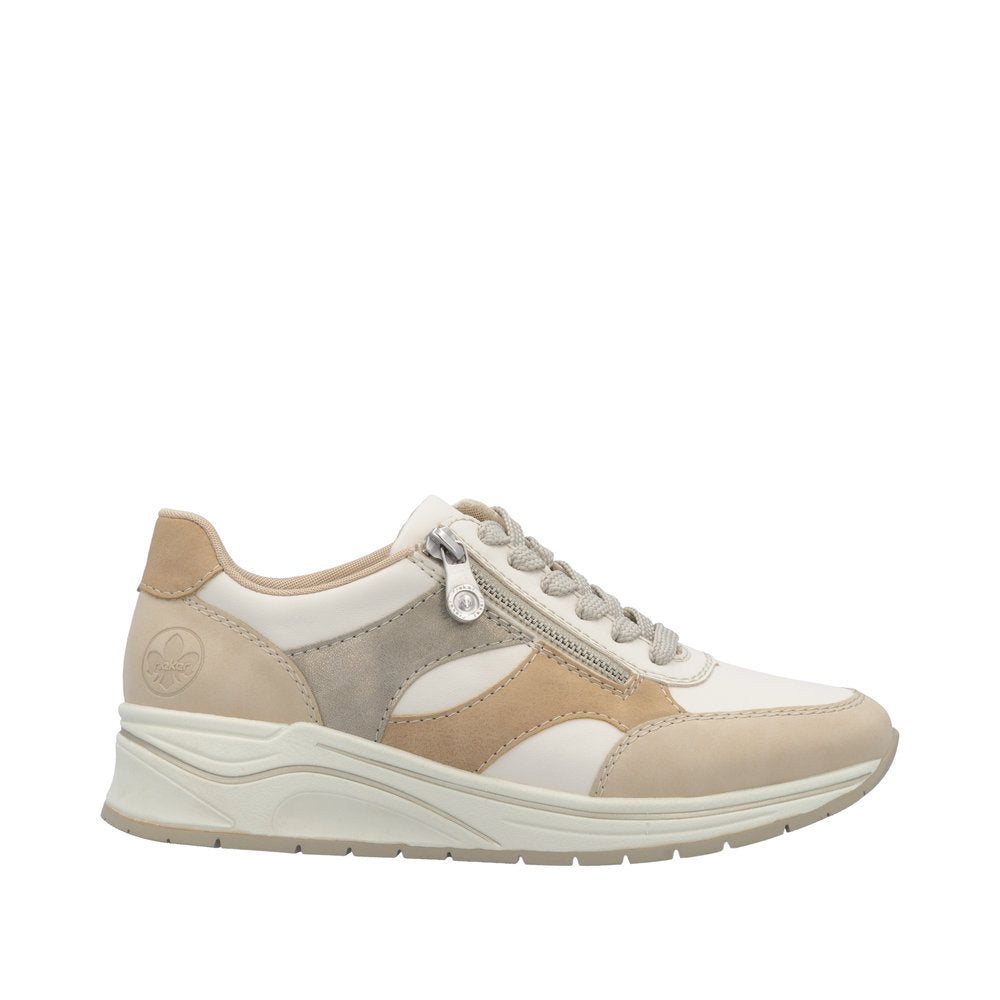 Rieker N9518-60 ladies wide-fit sneakers with multi zippers, lace-up design, neutral beige, gray, and white colors, and comfortable sole.