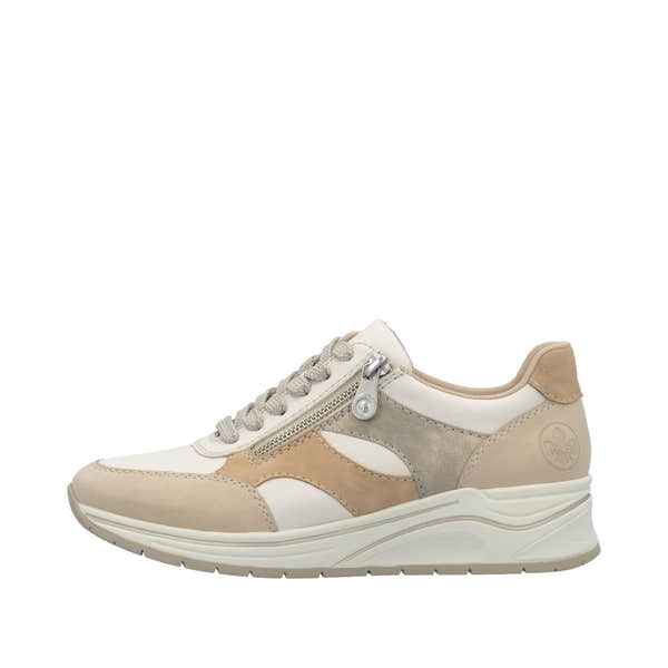 Rieker N9518-60 women's wide fit trainers with multi-zip and lace-up closure, beige and cream color, cushioned sole, casual sneaker style.