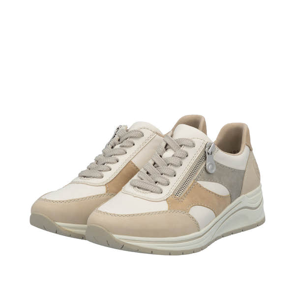 Rieker N9518-60 women's wide-fit multi-zip and lace casual trainers in beige and white with side zipper detail.