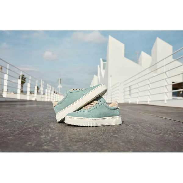 Mint suede lace-up trainers with white rubber soles, beige accents, and a casual, sporty style.