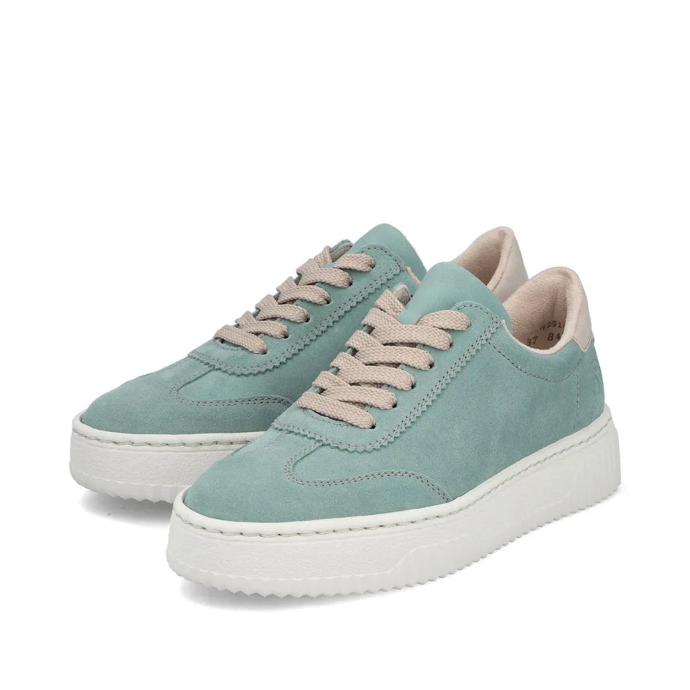 Mint green suede lace-up trainers with beige accents, thick white platform sole, casual style.