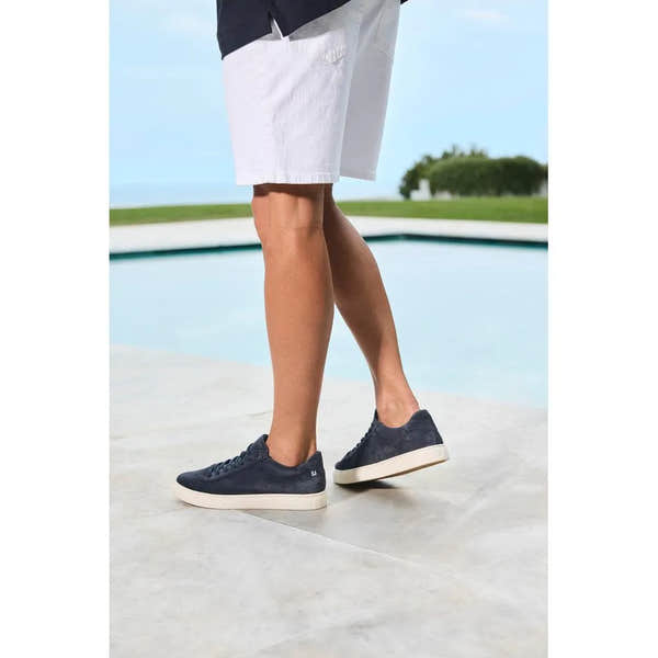 Men's blue suede lace-up shoes with white soles, casual stylish design.