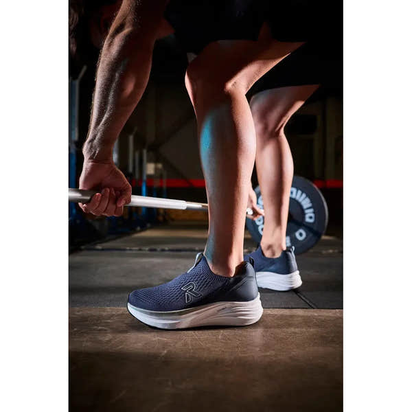 Rieker U4100-14 men's wide fit blue textile slip-on shoes, lightweight and sporty for active wear.