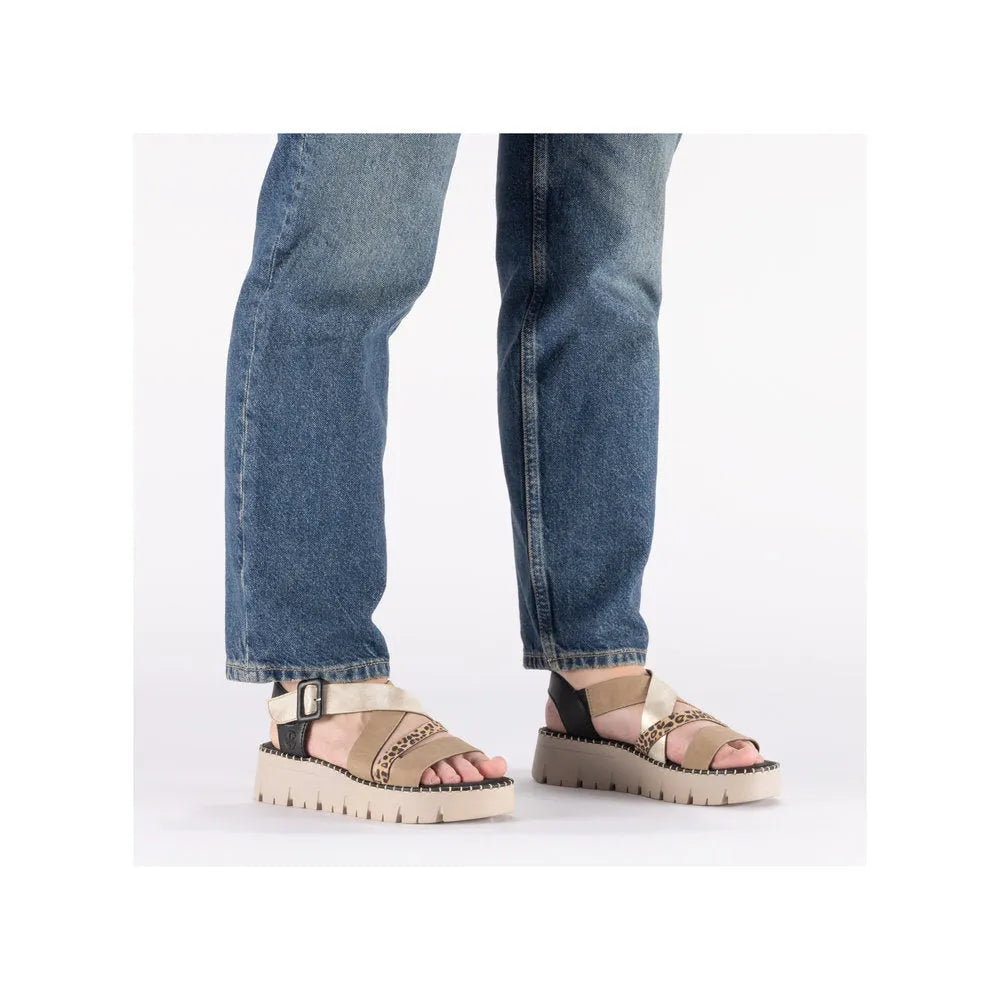 Rieker V1063-90 women's multi-touch fastening sandals with beige and animal print straps, chunky sole, and ankle buckle.