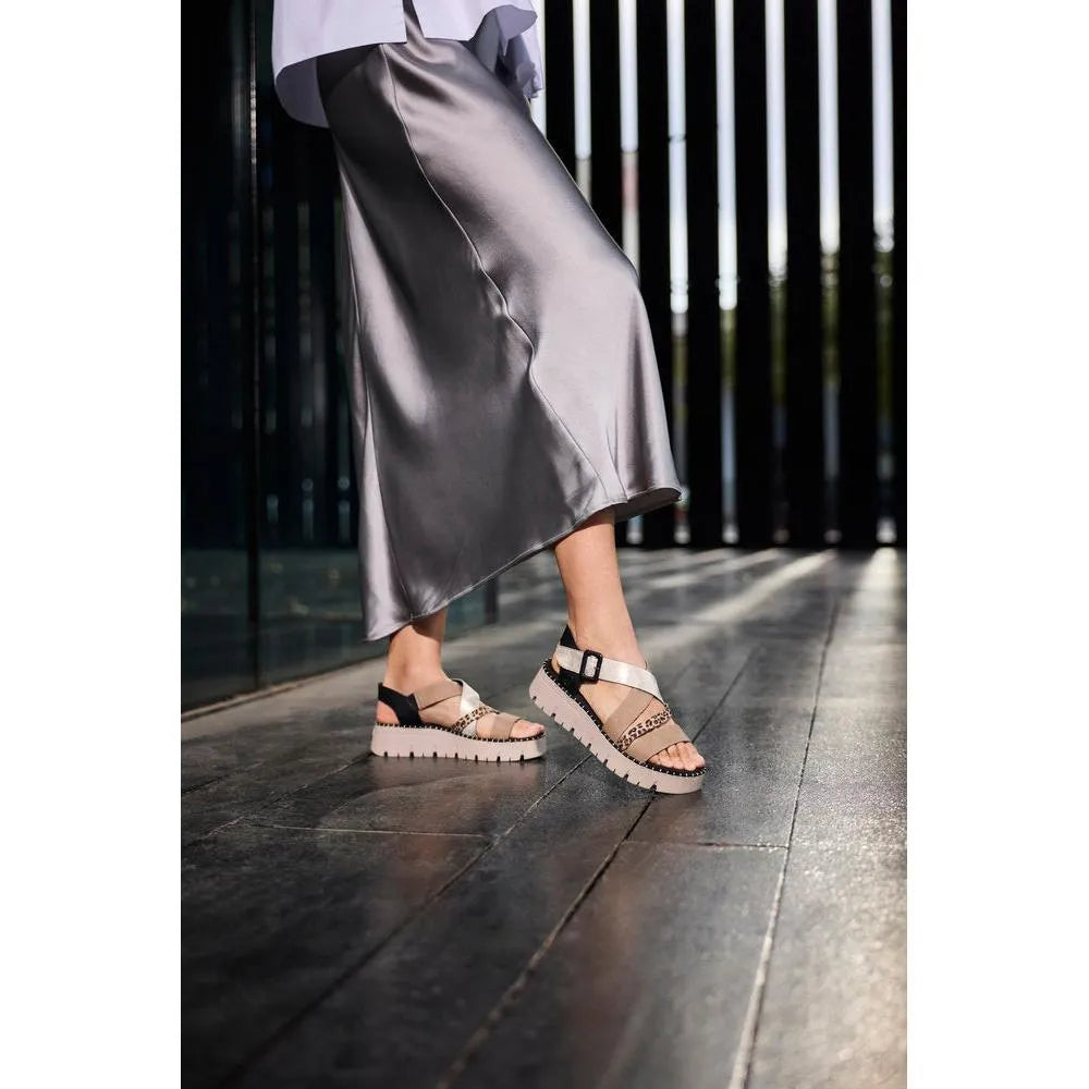 Rieker V1063-90 women's multi-touch fastening sandals with beige, leopard print, and black straps, chunky white sole, stylish design.