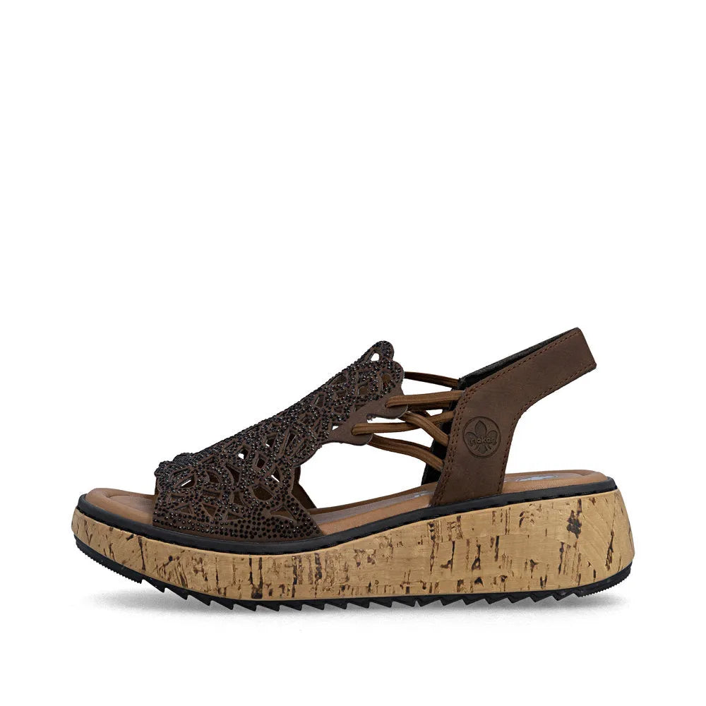 Rieker V1765-24 women's wide-fit brown elasticated sandals with perforated upper and cork platform sole.