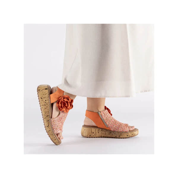 Rieker V1783-90 women's pumpkin orange textile side zip sandals with cork wedge heel and floral embellishment.