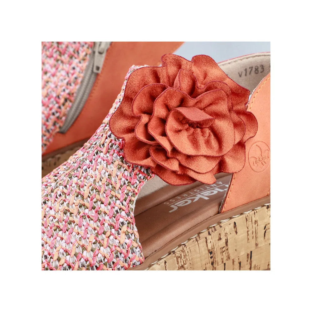 Rieker V1783-90 women's pumpkin orange textile wedge sandals with side zip and fabric flower embellishment.