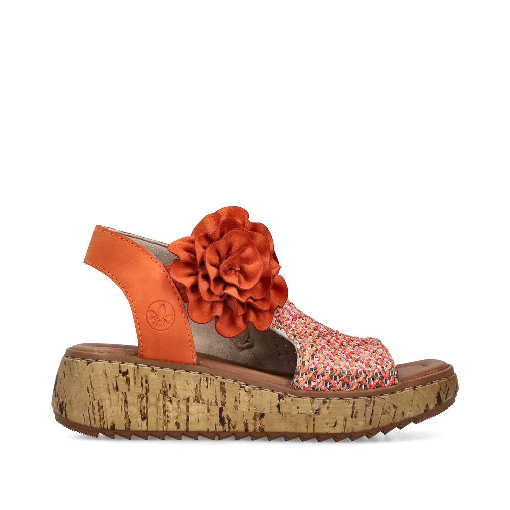 Rieker V1783-90 women's pumpkin orange textile wedge sandals with side zipper, floral detail, and cork platform sole.