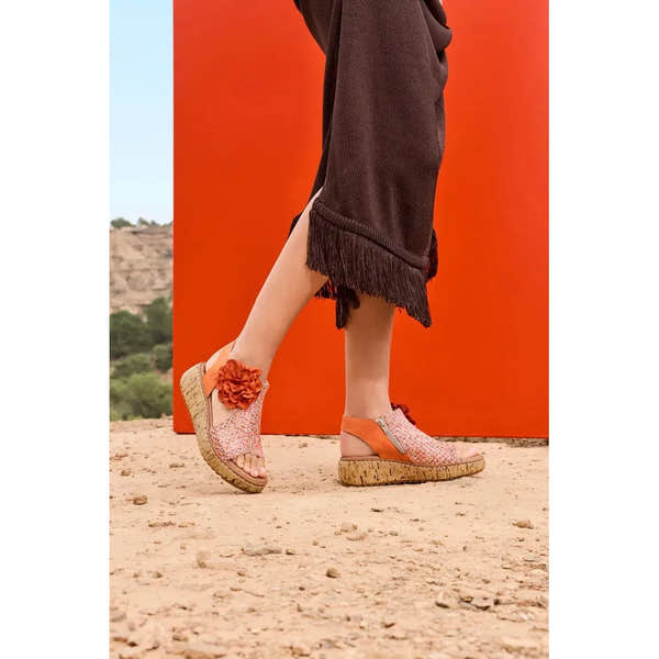 Rieker V1783-90 ladies pumpkin orange textile side zip sandals with floral embellishment and cork wedge sole.