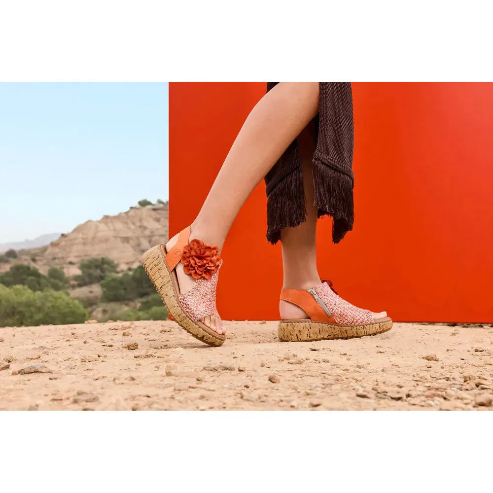 Rieker V1783-90 women's pumpkin orange textile side zip sandals with floral decoration and cork wedge sole.