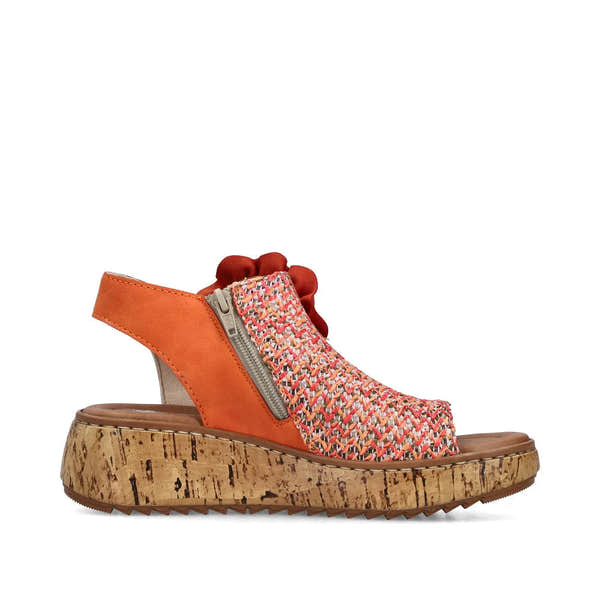 Rieker V1783-90 women's orange textile slide sandals with side zipper, cork platform sole, and woven design.