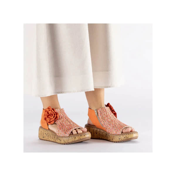 Rieker V1783-90 women's pumpkin orange textile side zip sandals with floral detail and cork wedge heel.