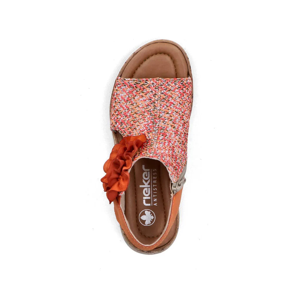 Rieker V1783-90 women's pumpkin orange textile slide sandals with side zipper and ruffled strap.