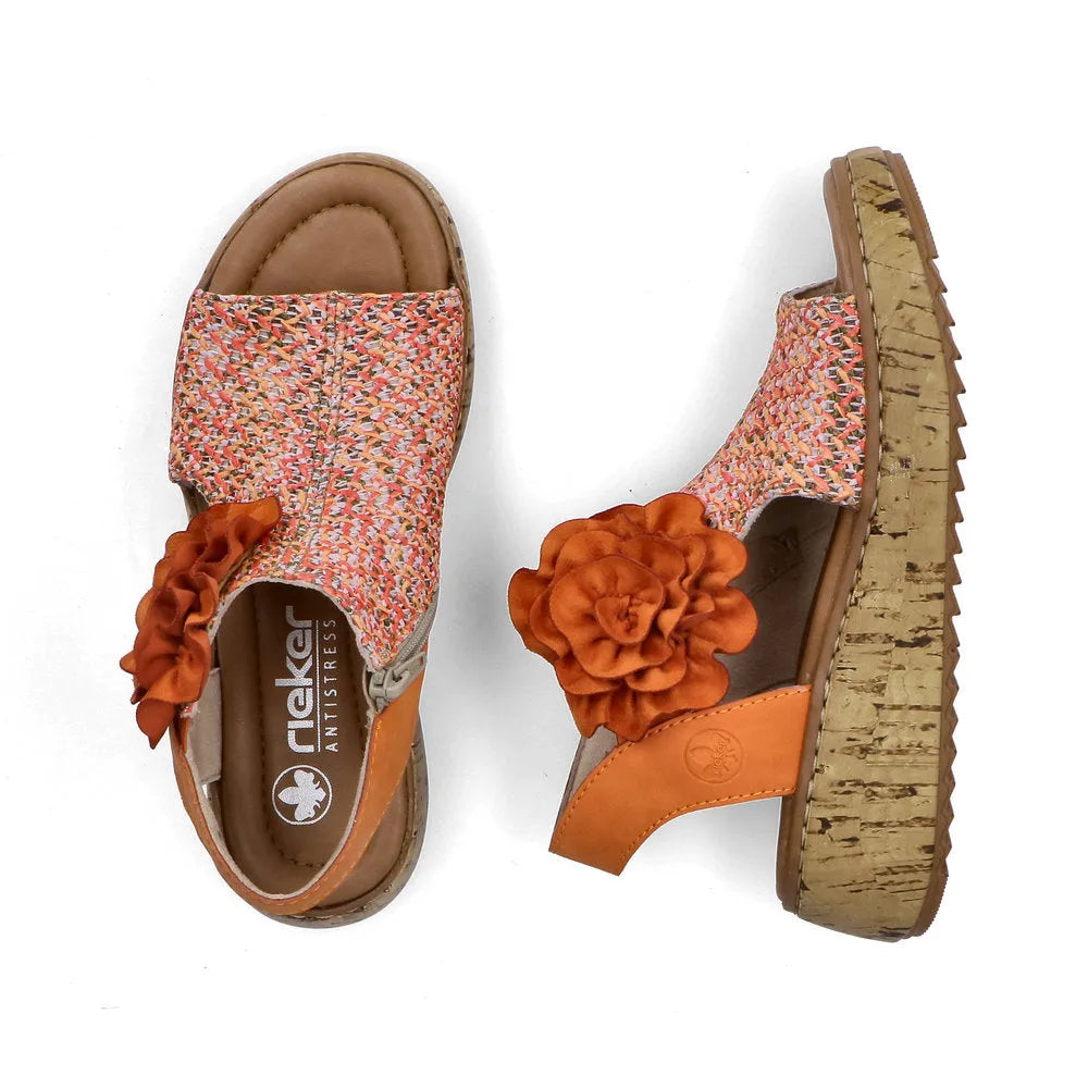 Rieker V1783-90 women's orange textile wedge sandals with side zipper, floral decoration, cushioned insole, and cork-like platform sole.