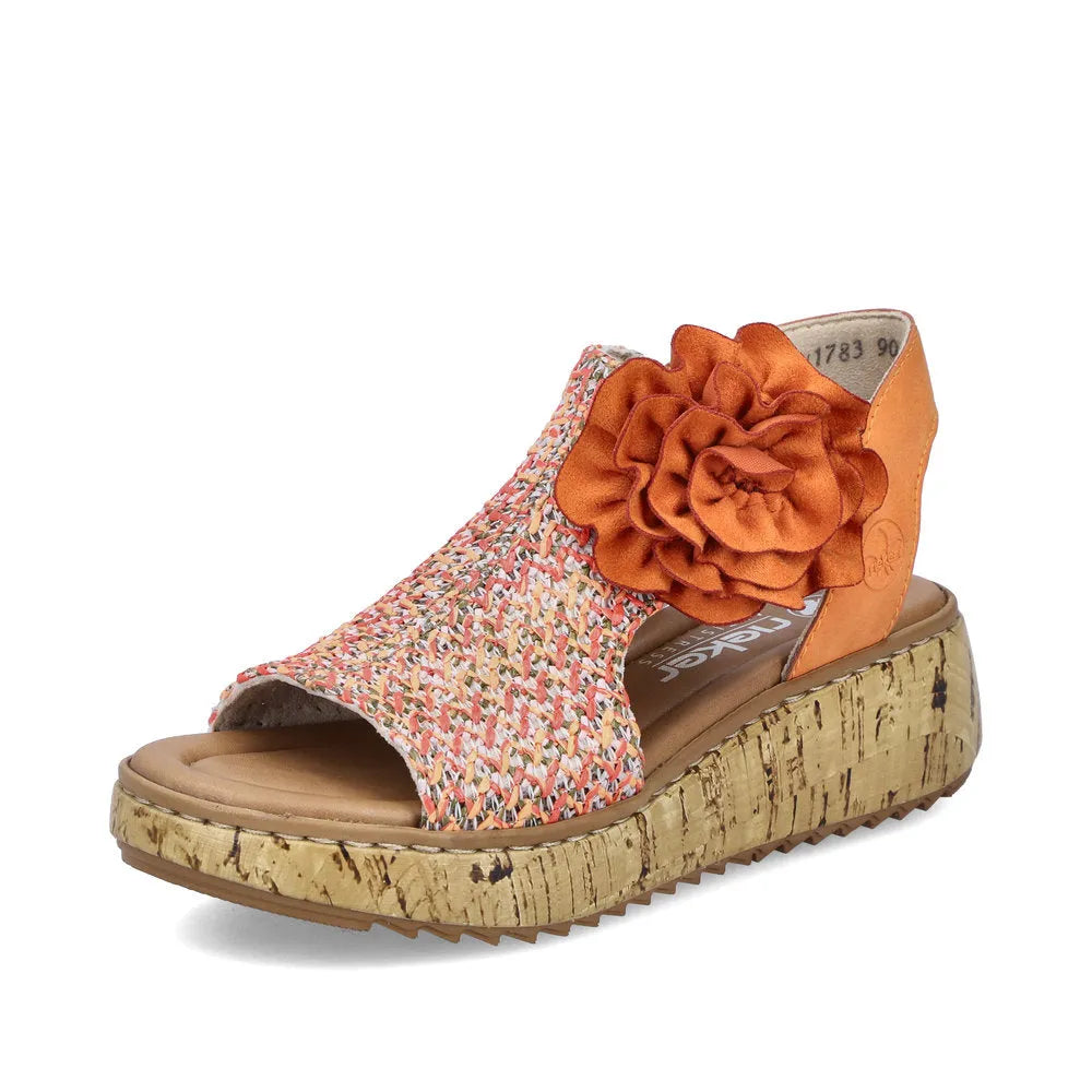 Rieker V1783-90 women's orange textile wedge sandals with side zip, floral details, and cork-like platform sole.