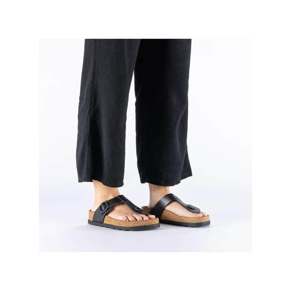 Rieker V3150-00 women's black leather buckle mule sandals with cork footbed and rubber sole.