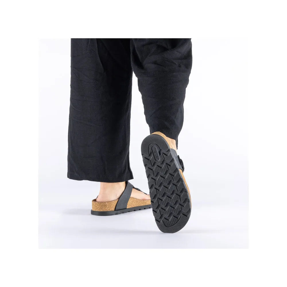Rieker V3150-00 ladies black leather buckle mules, open-toe slides with cork footbed and textured rubber outsole.