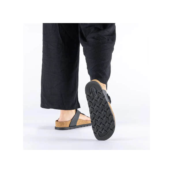 Rieker V3150-00 ladies black leather buckle mules, open-toe slides with cork footbed and textured rubber outsole.