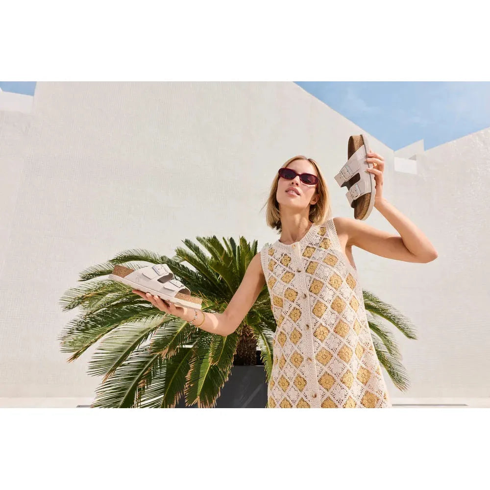 Rieker V3190-40 women's off-white leather buckle mule sandals with cork footbed, stylish summer footwear.