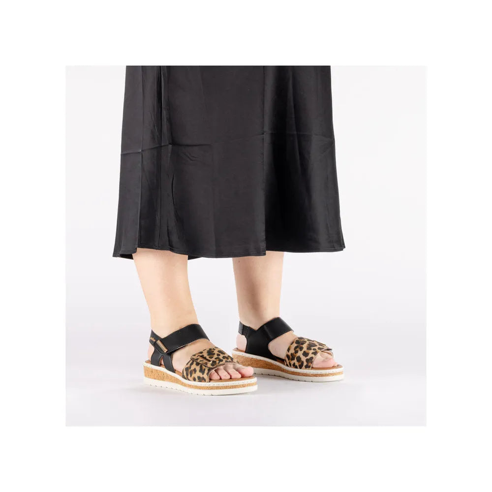 Rieker V4181-00 ladies wide multi-touch fastening sandals with leopard print and black straps, platform open-toe design.