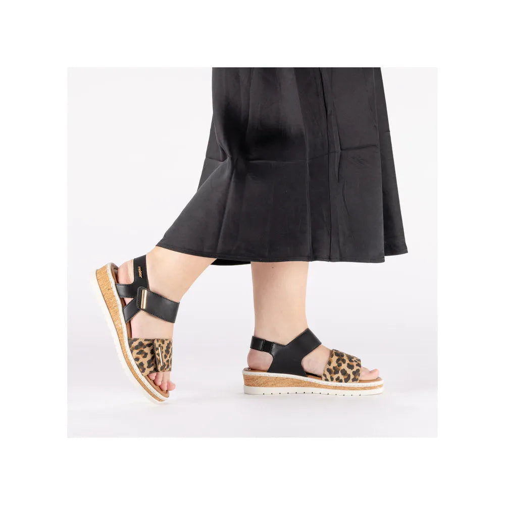 Rieker V4181-00 women's wide multi-touch fastening sandals with leopard print straps and cork platform sole.